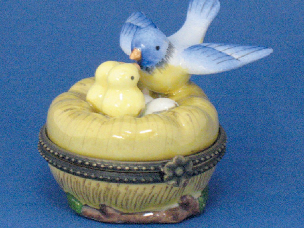 Appraisal: A CONTINENTAL ENAMEL BOX AND COVER modelled as a birds