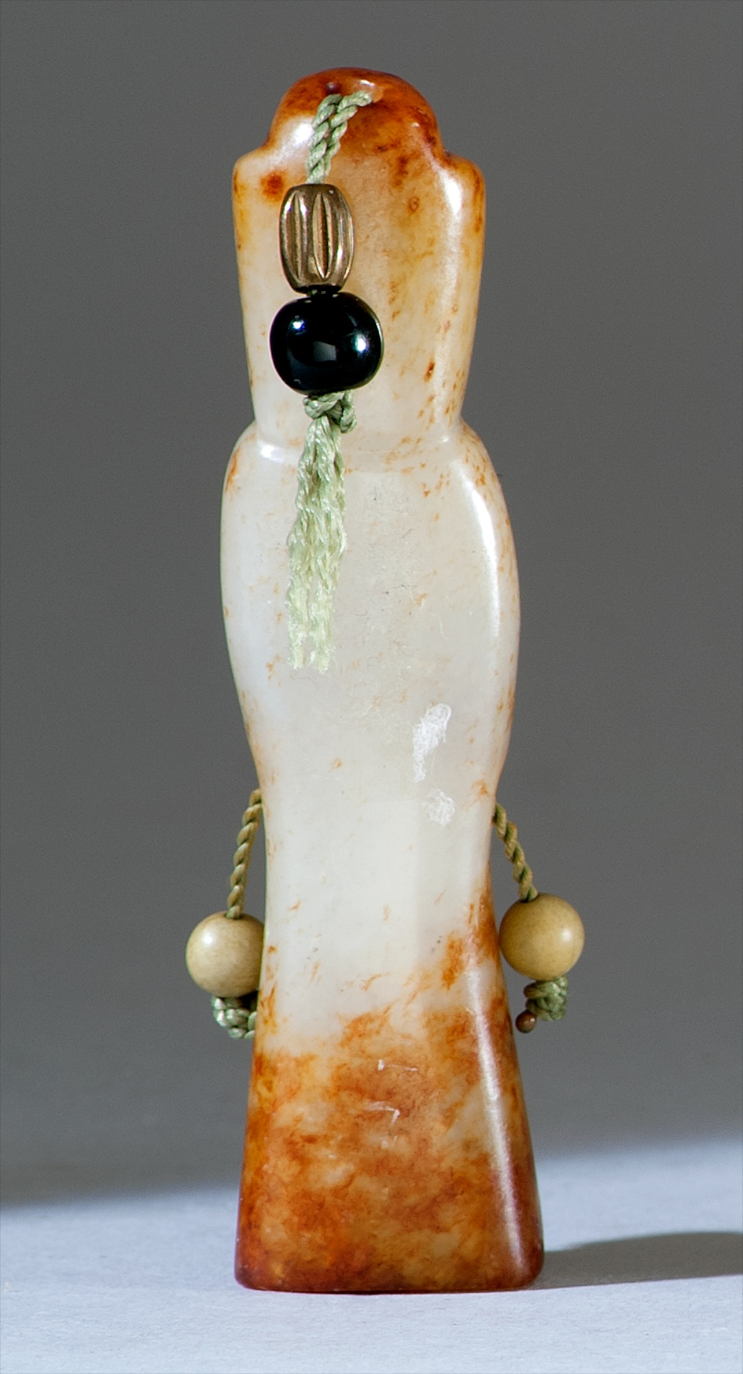 Appraisal: WHITE AND RUSSET JADE CARVING Han DynastyIn the form of