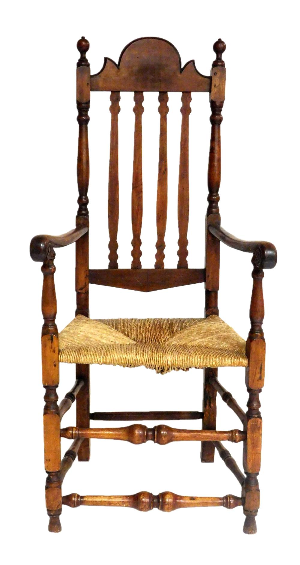 Appraisal: American bannister back armchair arched crest over four verticle stiles