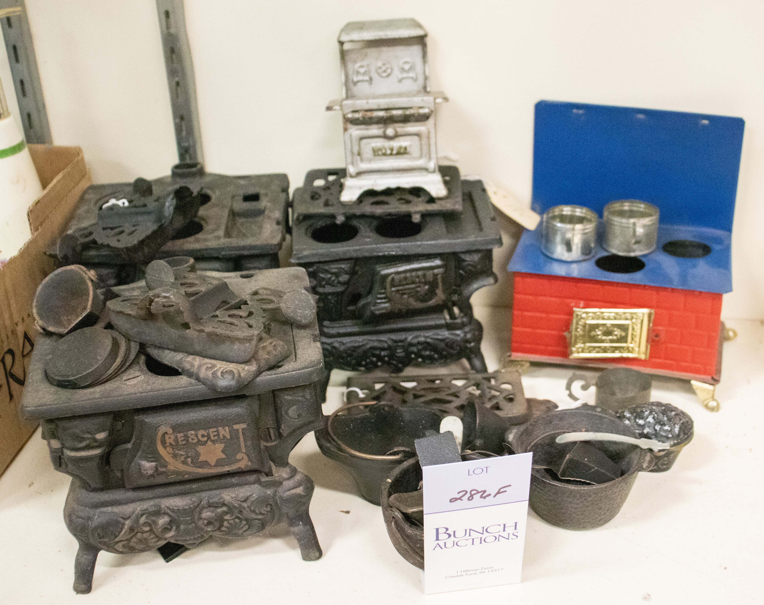 Appraisal: Lot of cast iron tin litho child's stoves accessories