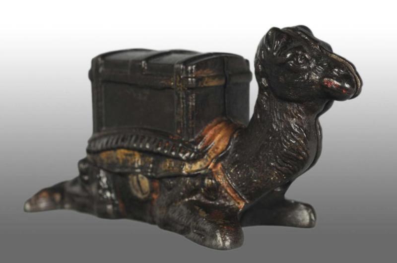 Appraisal: Cast Iron Kneeling Camel Still Bank Description American Manufactured by