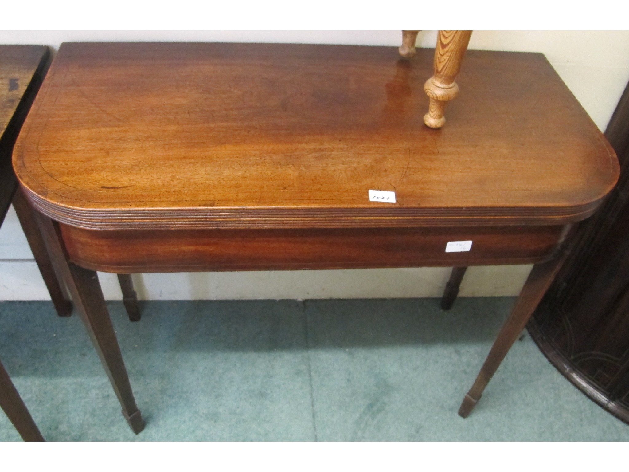 Appraisal: A mahogany fold over card table