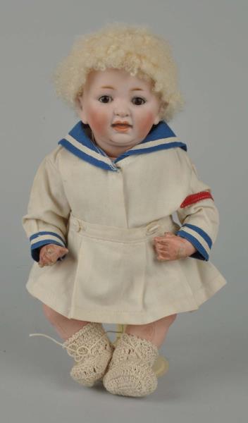 Appraisal: Blonde Bisque Head Doll Baby This doll is wearing a