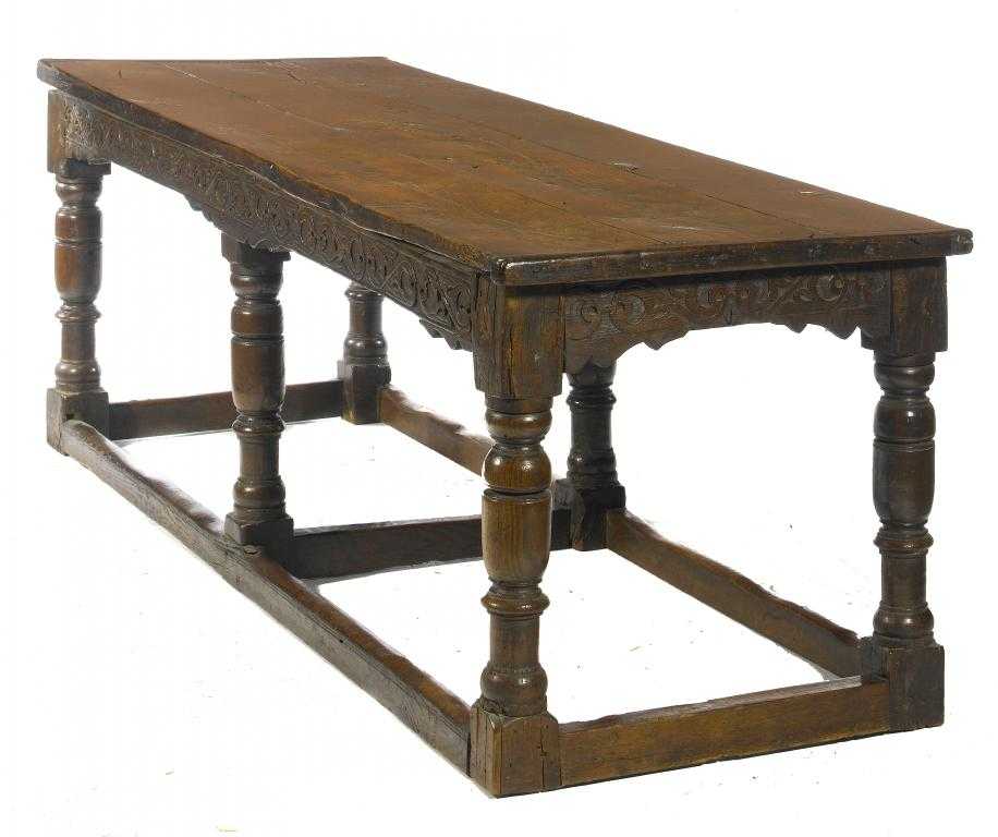 Appraisal: A CHARLES II JOINED OAK TABLE the three plank top