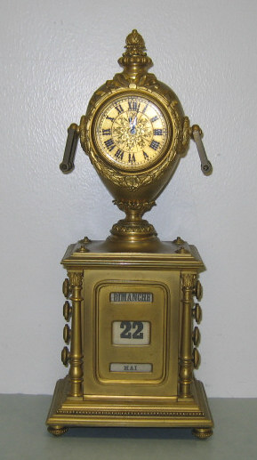 Appraisal: FRENCH SHELF CALENDAR CLOCK Classical style gilt metal urn-form case