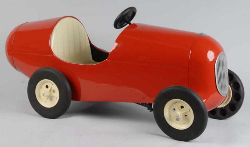 Appraisal: Pressed Steel Racing Pedal Car Toy Description Very unusual design