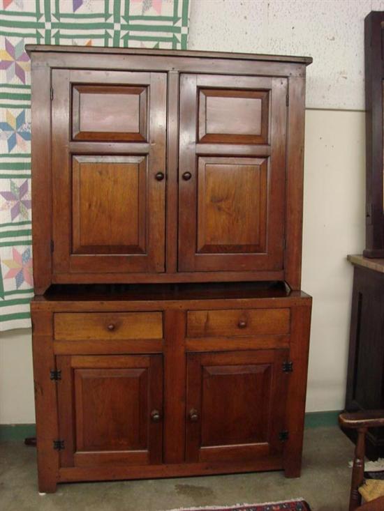 Appraisal: TWO PIECE STEPBACK CUPBOARD Dark stained walnut with paneled doors