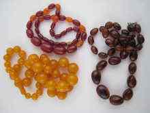 Appraisal: A mixed lot comprising two amber necklaces and a bead