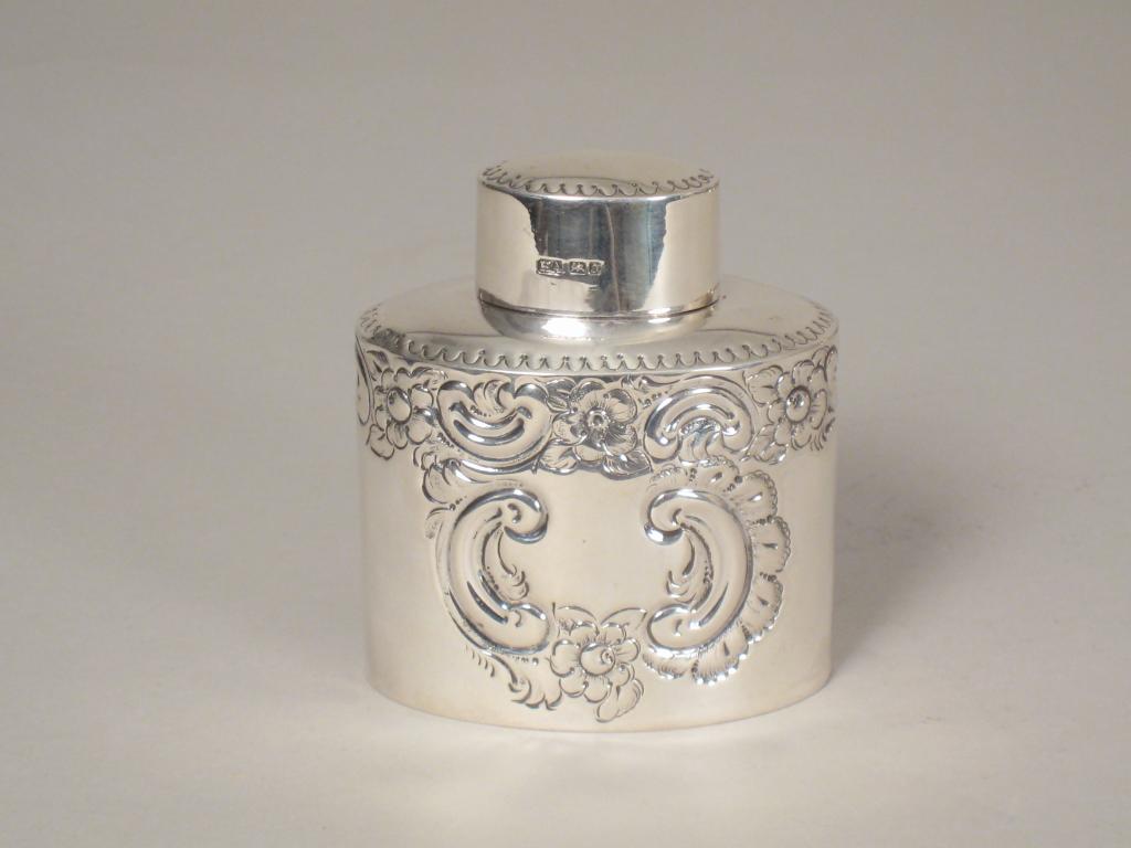 Appraisal: An Edward VII oval Tea Caddy floral and scroll embossed