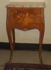 Appraisal: LOUIS XV STYLE PETITE COMMODE The three-drawer bombe commode stands