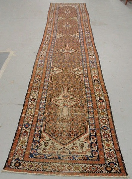 Appraisal: Oriental hall runner with four center geometric medallions x