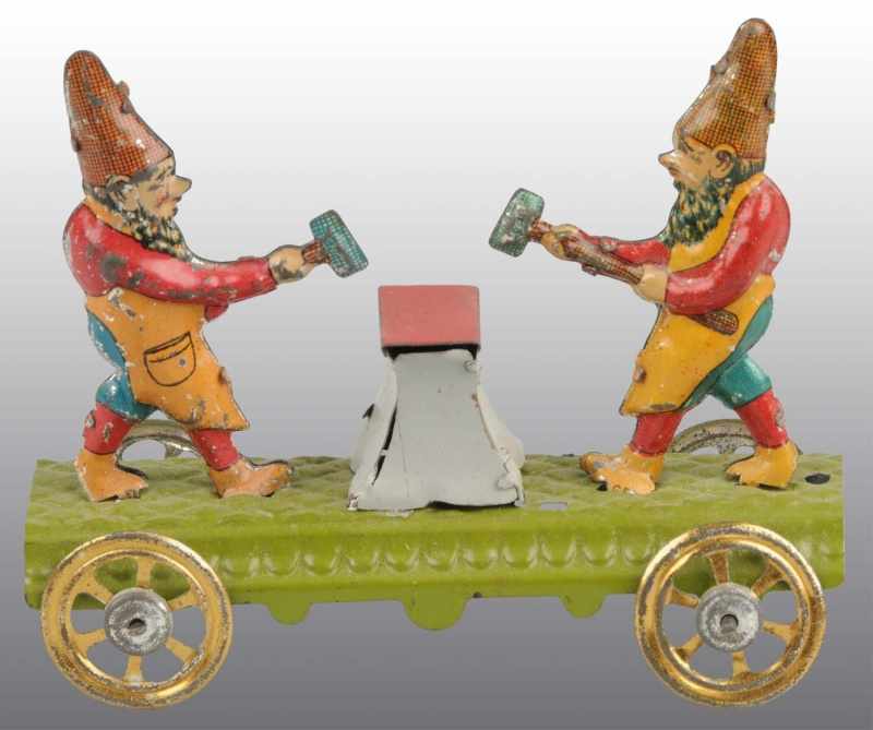 Appraisal: Tin Litho Gnomes Hammering Anvil Penny Toy Description German On