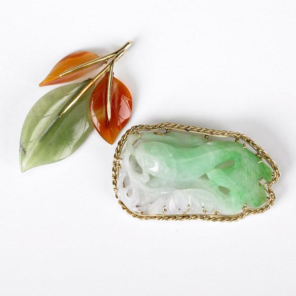 Appraisal: JADE AND K GOLD BROOCHES Two pierced and carved pieces