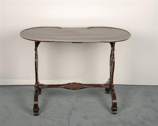 Appraisal: An Edwardian Mahogany Writing Table having a dished kidney shaped