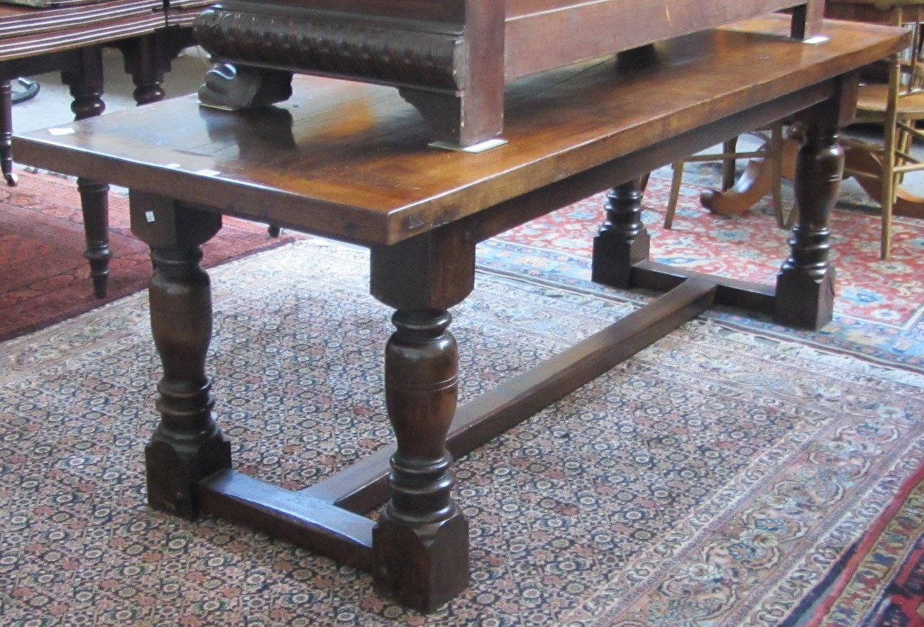 Appraisal: A th century style oak refectory tabe the cleated plank