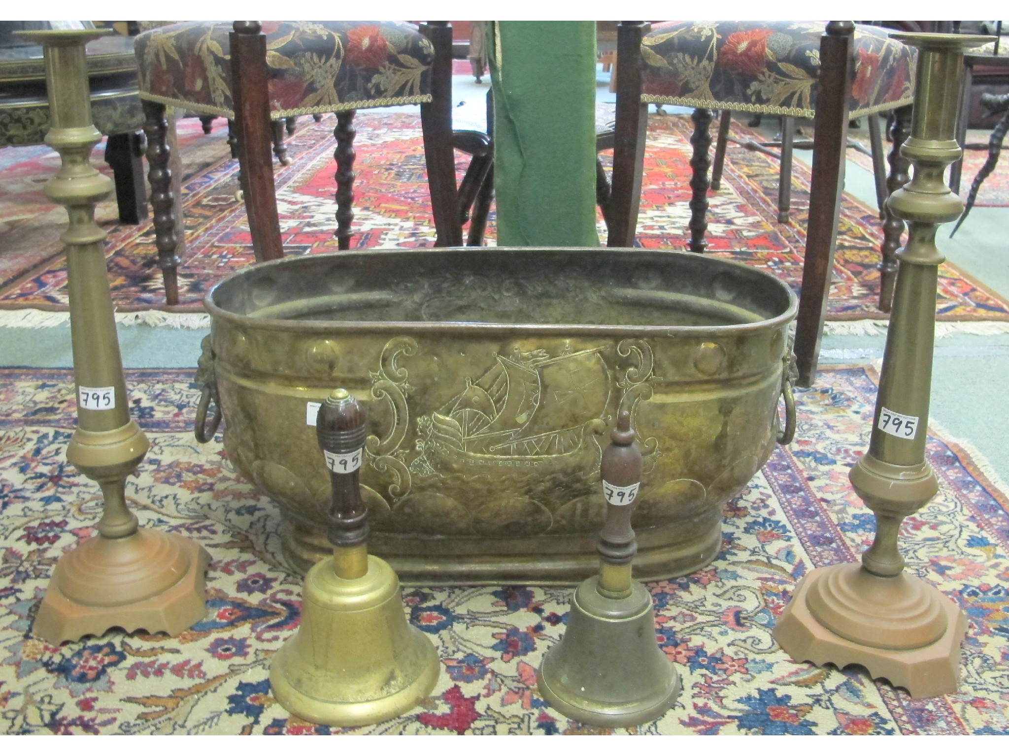 Appraisal: An oval brass planter a pair of large brass candlesticks