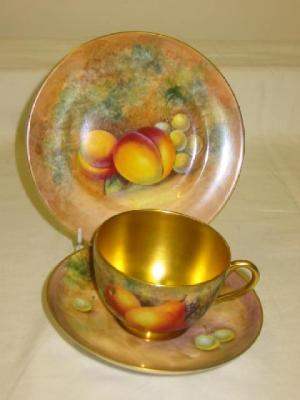 Appraisal: A ROYAL WORCESTER PORCELAIN TRIO painted with apples peaches grapes