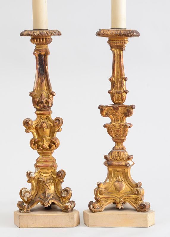 Appraisal: TWO SIMILAR ITALIAN ROCOCO STYLE CARVED GILTWOOD CANDLESTICK LAMPS Each