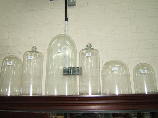 Appraisal: A PAIR OF GLASS DOMES with air bubble knop handles