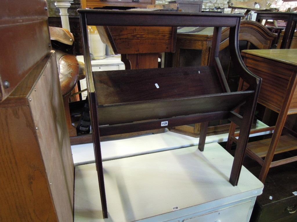 Appraisal: A mahogany book stand trough raised on cut and moulded