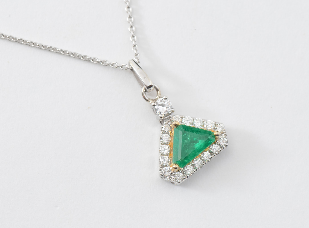 Appraisal: K EMERALD AND DIAMOND PENDANT CHAIN K white gold emerald