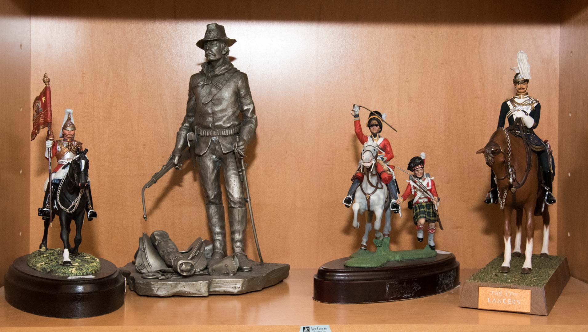 Appraisal: Four painted and unpainted pewter soldiers