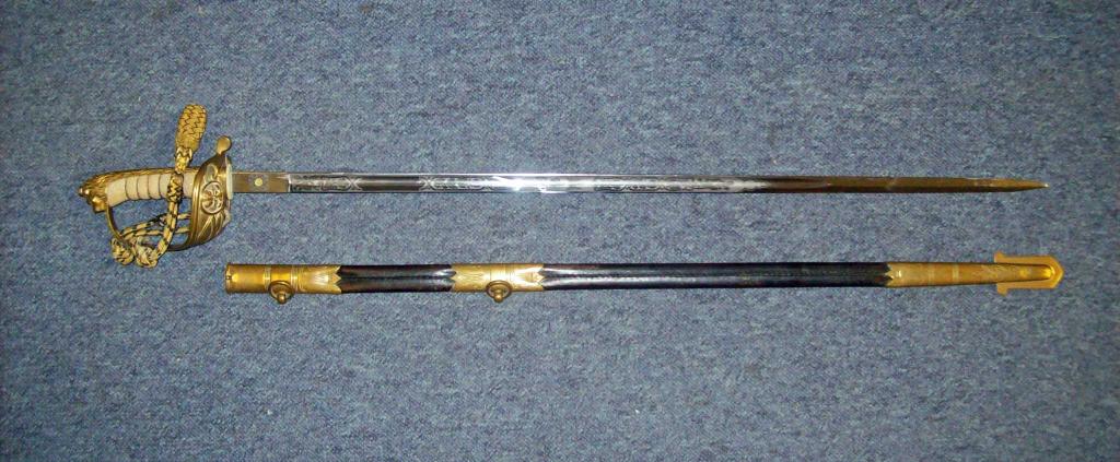 Appraisal: A Naval Officer's sword in scabbard -