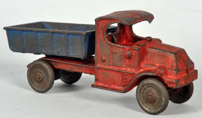 Appraisal: Cast Iron Dump Truck Toy American Possibly Champion Heavy wear