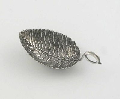 Appraisal: A George III veined-leaf caddy spoon with a coiled wire