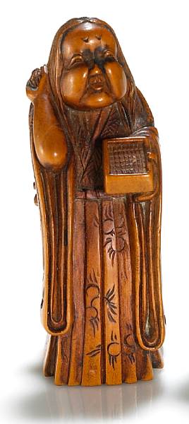 Appraisal: A boxwood figural netsuke By Masayoshi th Century Showing Okame