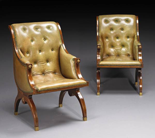 Appraisal: A pair of Russian Empire style mahogany armchairs The rectangular