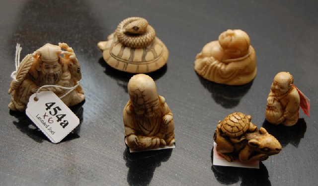 Appraisal: A COLLECTION OF JAPANESE IVORY AND BONE NETSUKE Comprising five