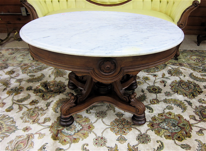 Appraisal: VICTORIAN MARBLE-TOP WALNUT COFFEE TABLE Renaissance Revival style American c