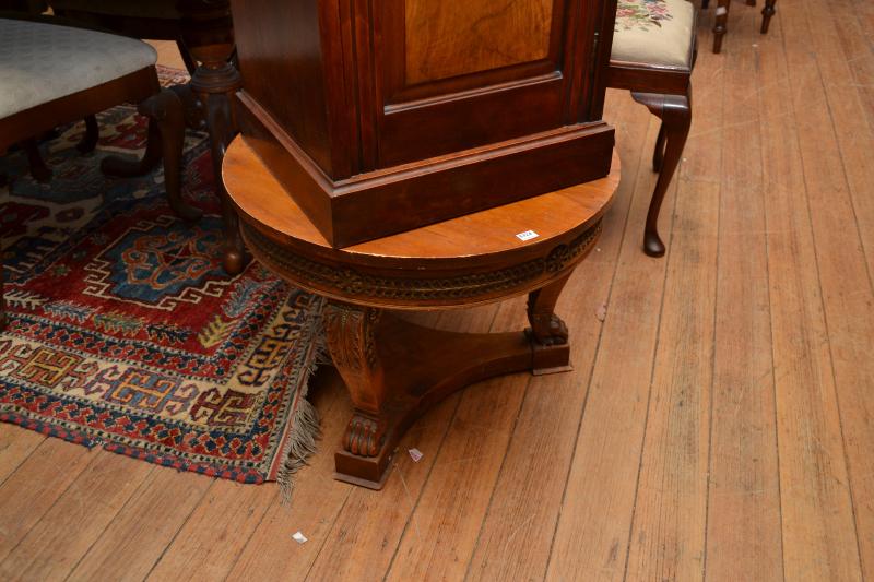 Appraisal: AN EMPIRE STYLE OCCASIONAL TABLE WITH GILT AND CARVED FEATURES