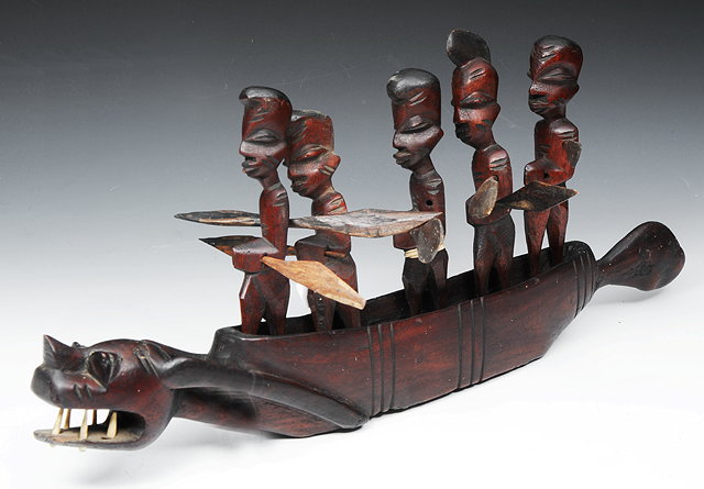 Appraisal: A TRIBAL CARVED WOODEN MODEL of a canoe in the