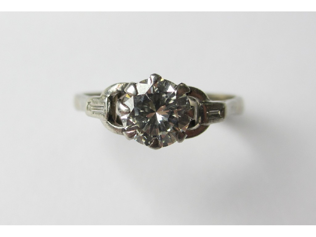 Appraisal: A platinum diamond solitaire ring with brilliant cut diamond measuring