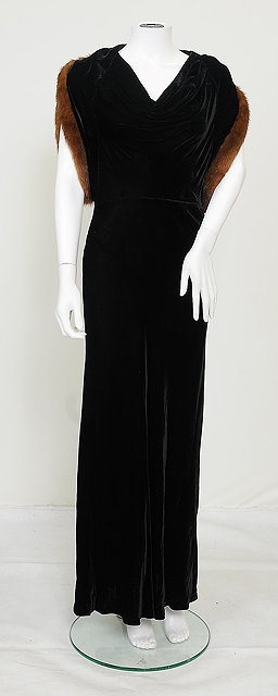 Appraisal: A s long black velvet dress with large draping sleeves