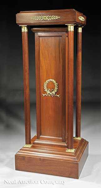 Appraisal: An Empire-Style Mahogany and Ormolu-Mounted Pedestal square top on columnar