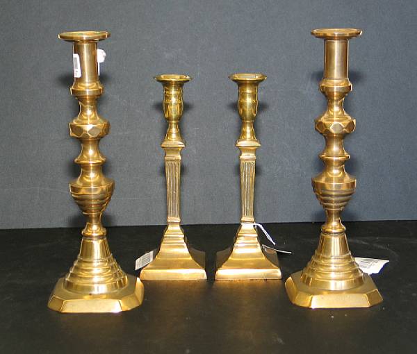 Appraisal: Two pairs of George III brass candlesticks The first pair