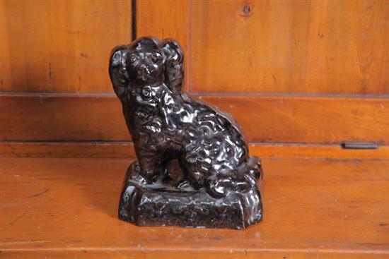 Appraisal: SEATED DOG FIGURE Sewertile type dog on a rectangular base