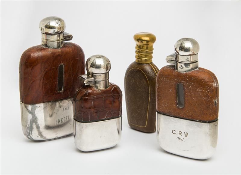 Appraisal: ENGLISH SILVER-MOUNTED AND ALLIGATOR SKIN-CLAD SMALL GLASS FLASK James Dixon