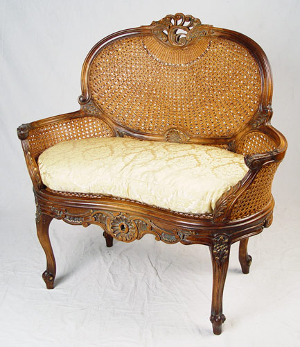 Appraisal: FRENCH LOUIS XVI STYLE CARVED AND CANED SETTEE With double