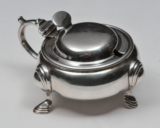 Appraisal: A GEORGE V SILVER BUN SHAPED MUSTARD POT standing on