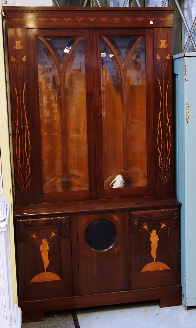 Appraisal: A th century Continental marquetry inlaid Art Nouveau display cabinet