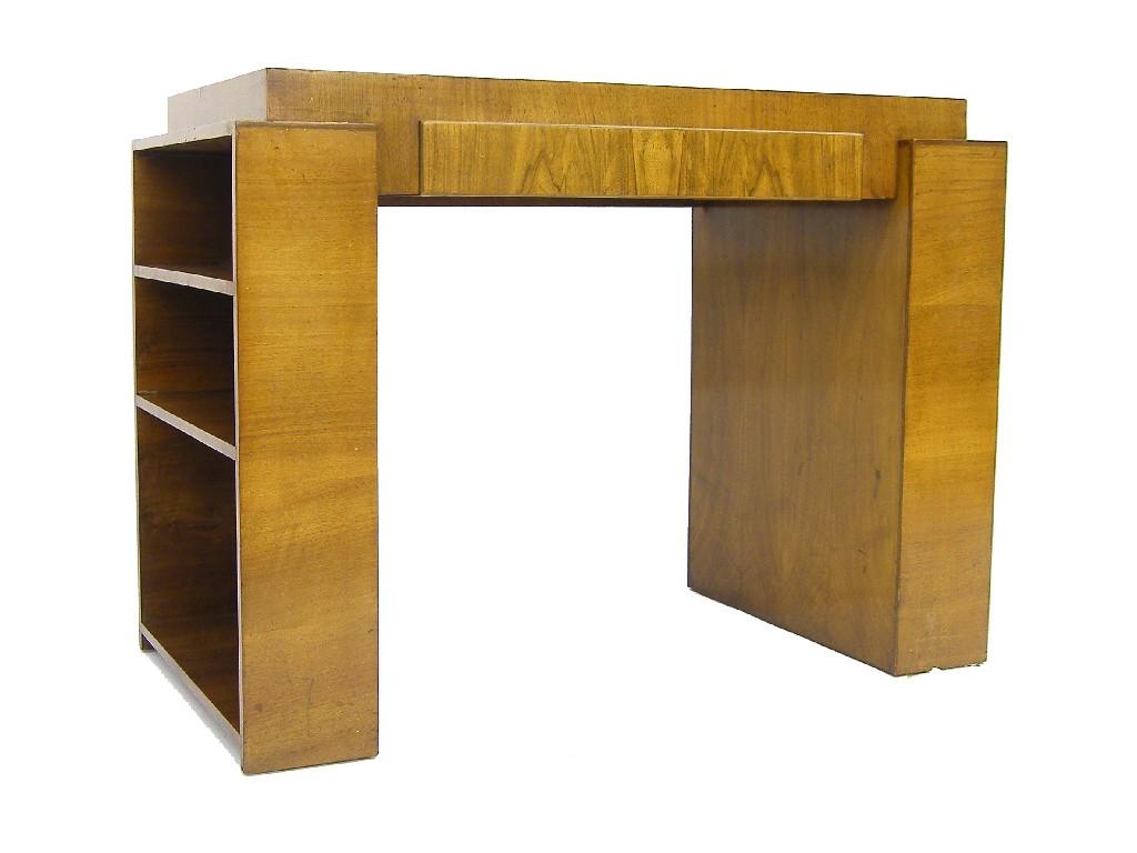 Appraisal: Art Deco walnut kneehole desk the stepped leather inset top