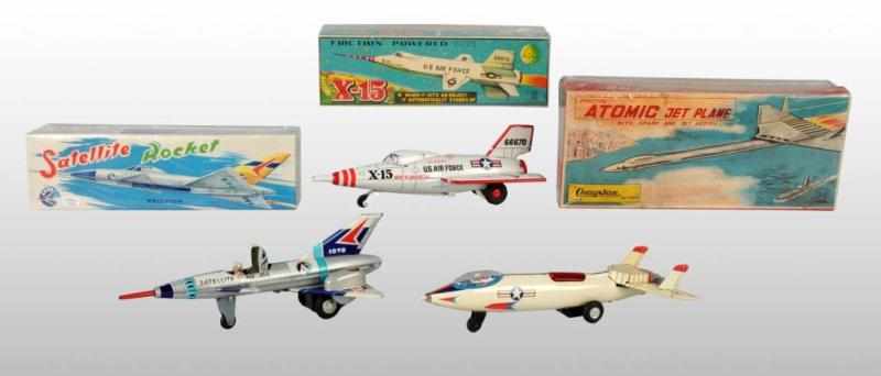 Appraisal: Lot of Tin Military Jet Plane Friction Toys Description Working