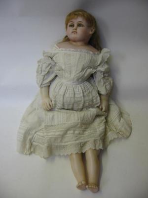 Appraisal: A poured wax shoulder head girl doll with head to