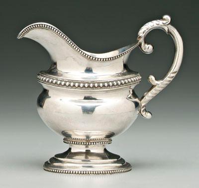 Appraisal: Coin silver cream pitcher helmet form oval tapering body die-rolled