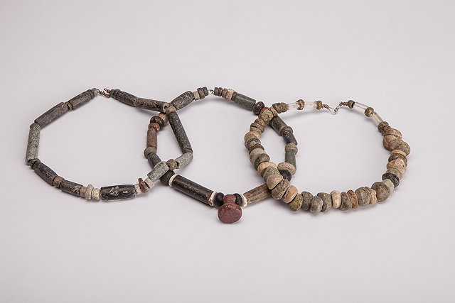 Appraisal: TWO SOUTH AMERICAN STONE BEAD NECKLACES and a row of