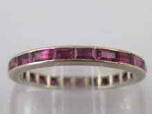 Appraisal: A white metal tests carat gold ruby eternity ring size